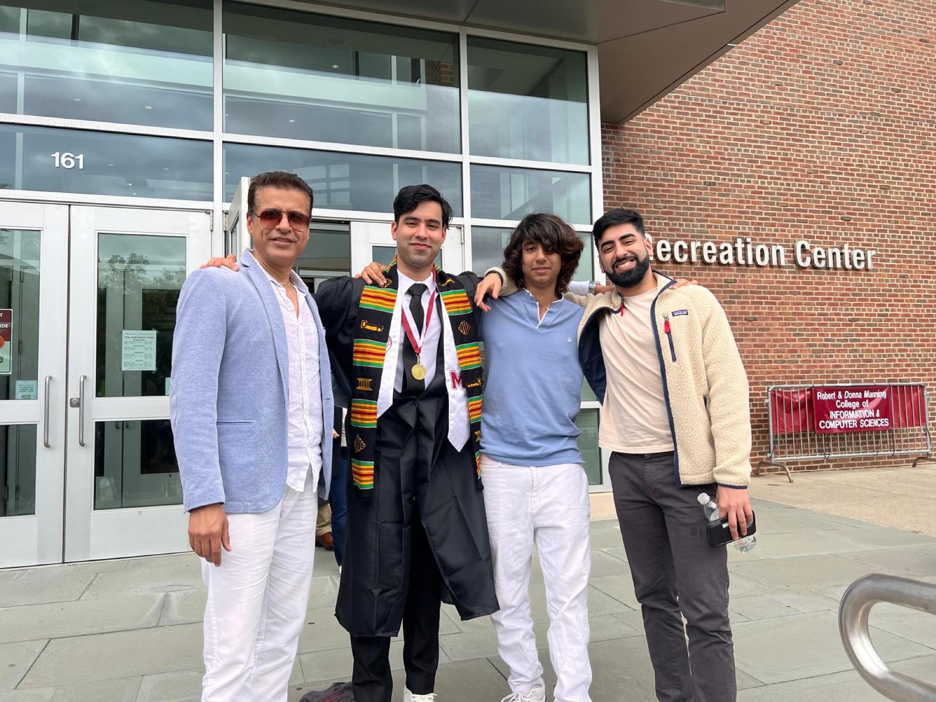 Kabir Israni at his graduation ceremony with his brothers