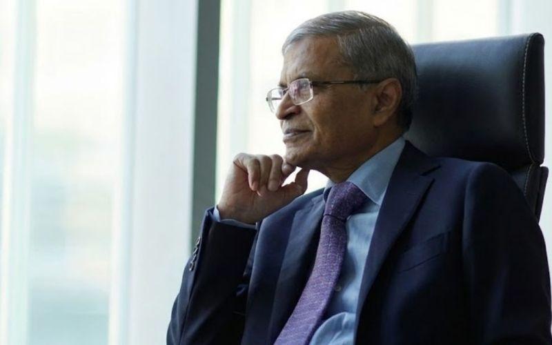 Senior business executive seated in an office setting, representing an investor testimonial about confidence in compliant U.S. real estate investing